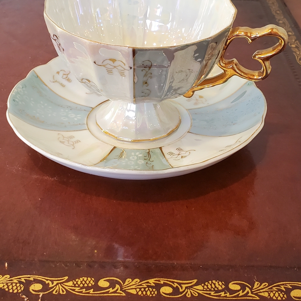 Vintage Japanese lusterware teacup and saucer set imported by UCAGCO